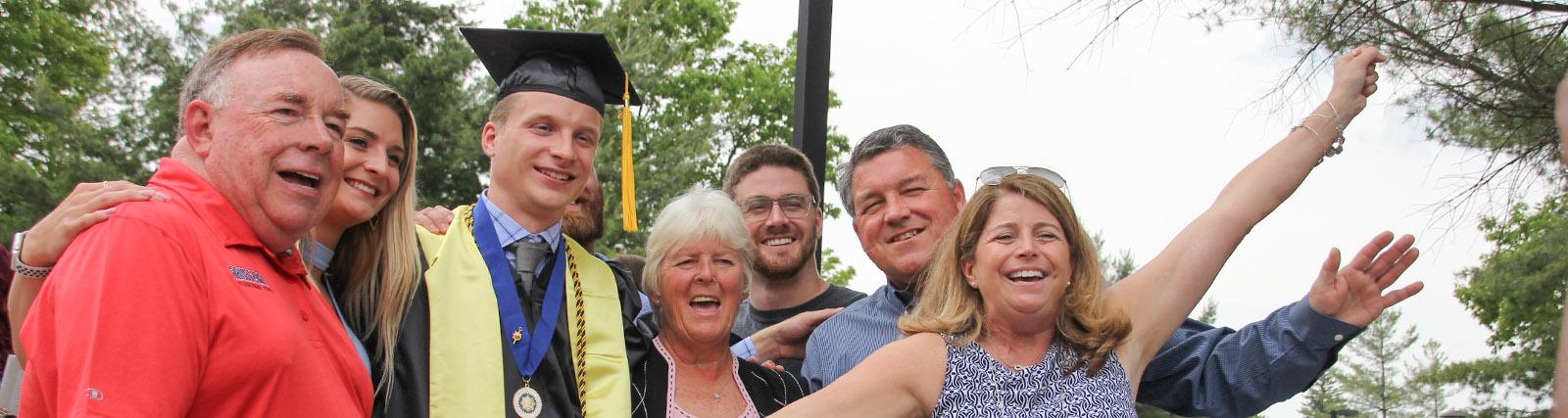 family celebrates their graduate