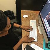 Student worker Joia Bullock working at Computer
